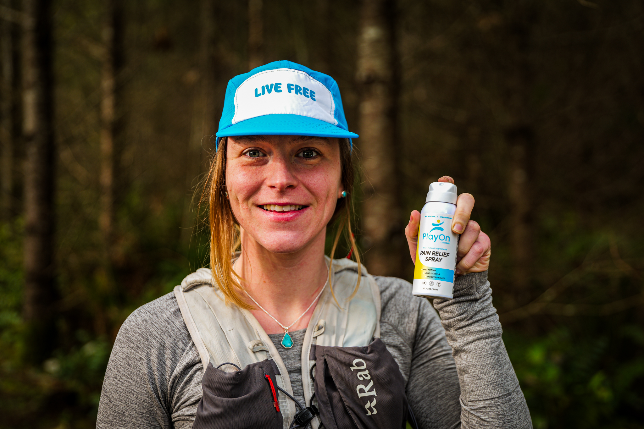 Athlete holding PlayOn product on trail