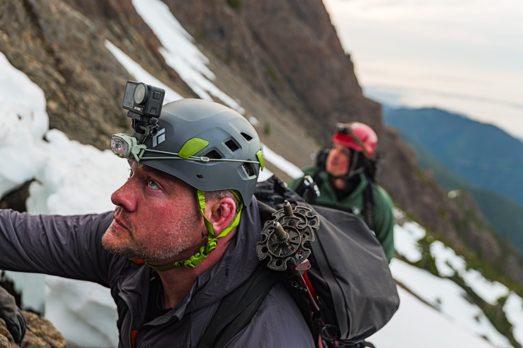 Climber with action cam looking up